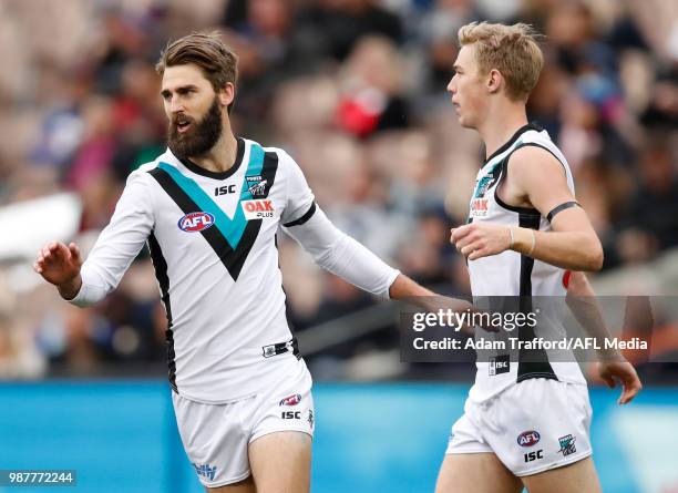 Justin Westhoff of the Power celebrates a goal with Todd Marshall of the Power during the 2018 AFL round 15 match between the Carlton Blues and the...