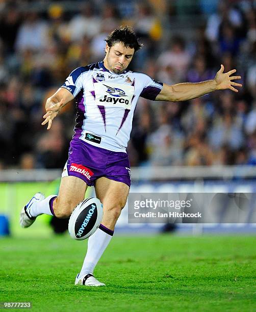 Cooper Cronk of the Storm kicks the ball during the round eight NRL match between the North Queensland Cowboys and the Melbourne Storm at Dairy...