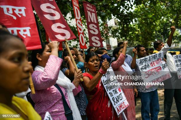 Indian women protest against the rape of the eight year old in Mandsaur, Madhaya Pradesh, in New Delhi on June 30, 2018. - Hundreds of protesters...