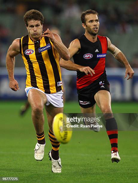 Campbell Brown of the Hawks competes for the ball against Mark McVeigh of the Bombers during the round six AFL match between the Essendon Bombers and...