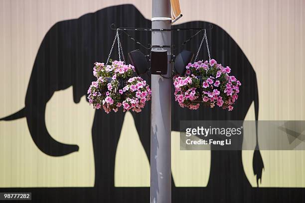 Two basins of flowers are hung outside Africa Pavilion on the opening day of the Shanghai World Expo on May 1, 2010 in Shanghai, China. Shanghai...