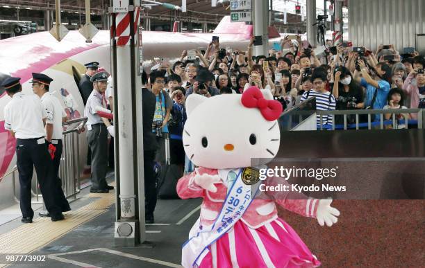 Shinkansen bullet train featuring Hello Kitty livery starts services on June 30 with people observing the arrival of the first train at Shin-Osaka...