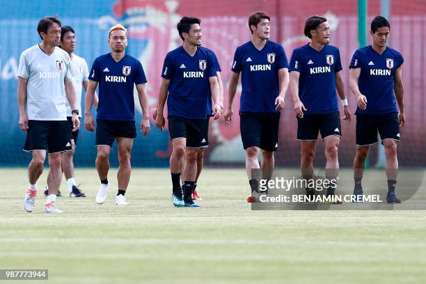 Japan's forward Shinji Okazaki takes part in a training session with teammates in Kazan on June 30 during the Russia 2018 World Cup football...