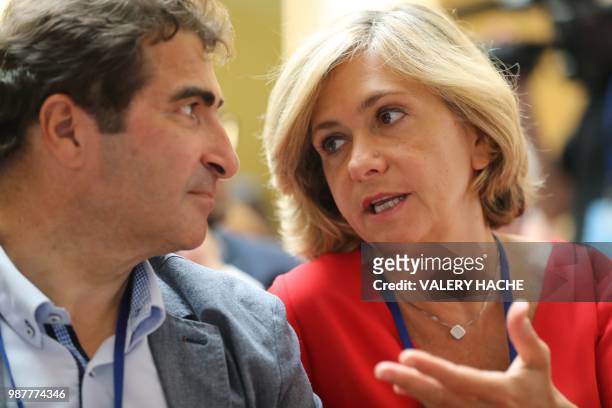 Member of Les Republicains right-wing party Christian Jacob listens to head of the Ile-de-France regional council and member of the LR party Valerie...