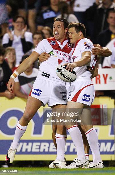 Darius Boyd of the Dragons congratulates team mate Brett Morris after Morris scored during the round eight NRL match between the St George Dragons...