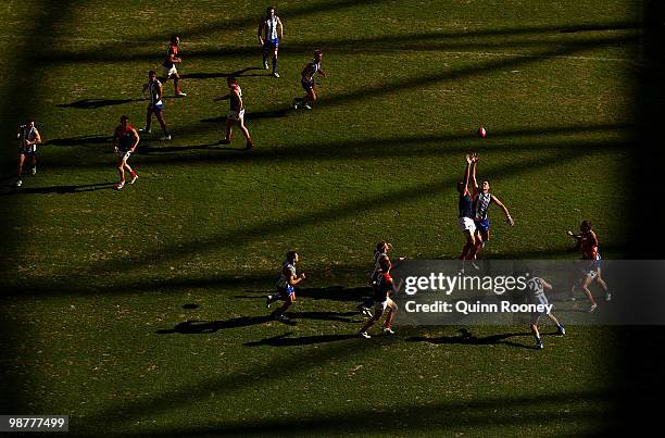 David Hale of the Kangaroos and Mark Jamar of the Demons contest for the ball during the round six AFL match between the North Melbourne Kangaroos...