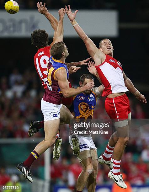 Jesse White of the Swans and Joel Patfull of the Lions compete for a mark during the round six AFL match between the Sydney Swans and the Brisbane...