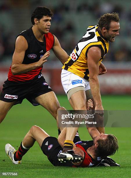 Andrew Welsh of the Bombers clashes with Brad Sewell of the Hawks during the round six AFL match between the Essendon Bombers and the Hawthorn Hawks...