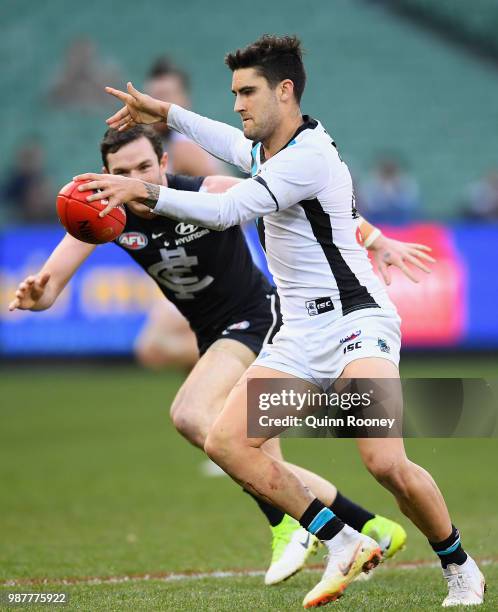 Chad Wingard of the Power kicks during the round 15 AFL match between the Carlton Blues and the Port Adelaide Power at Melbourne Cricket Ground on...