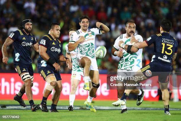 During the round 17: Anton Lienert-Brown of the Chiefs kicks the ball through during the Super Rugby match between the Highlanders and the Chiefs at...