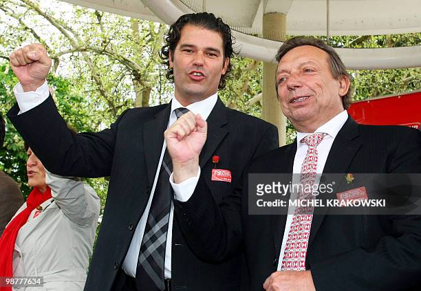 Seraing's mayor Alain Mathot and Belgian Minister of Pensions and Urban Policy Michel Daerden raise their fists during a French-speaking socialist...