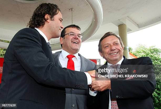 Seraing's mayor Alain Mathot , shakes hands with Minister of Pensions and Urban Policy Michel Daerden next to Liege's mayor Willy Demeyer during a...