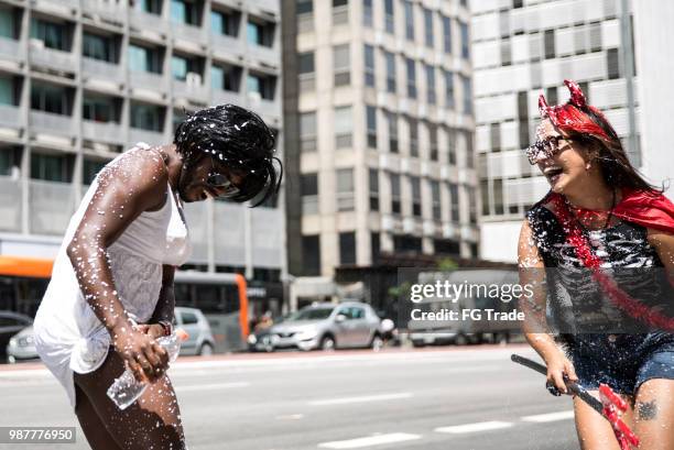 friends having fun on a carnaval celebration in brazil - halloween in sao paulo stock pictures, royalty-free photos & images