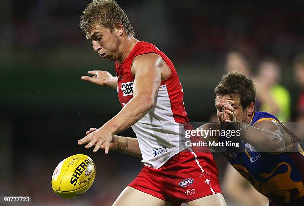 Kieren Jack of the Swans gets a kick away under pressure during the round six AFL match between the Sydney Swans and the Brisbane Lions at the Sydney...