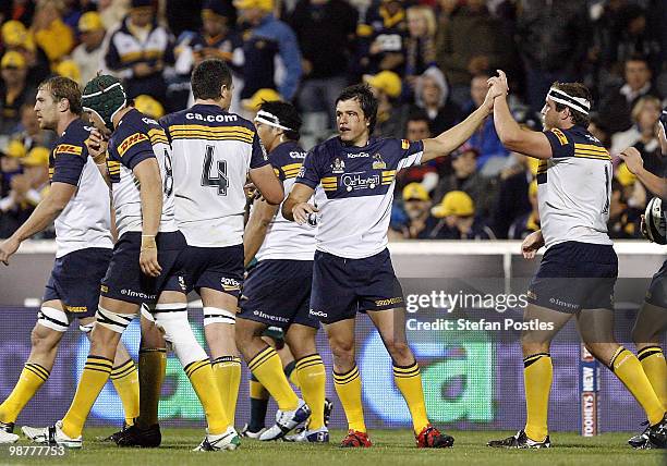 Adam Ashley-Cooper high fives Ben Alexander of the Brumbies after he scored a try during the round 12 Super 14 match between the Brumbies and the...