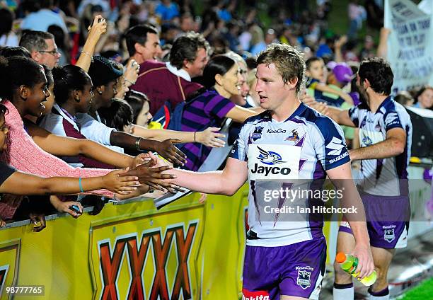 Cameron Smith and Brett Finch of the Storm acknowledge fans after winning the round eight NRL match between the North Queensland Cowboys and the...
