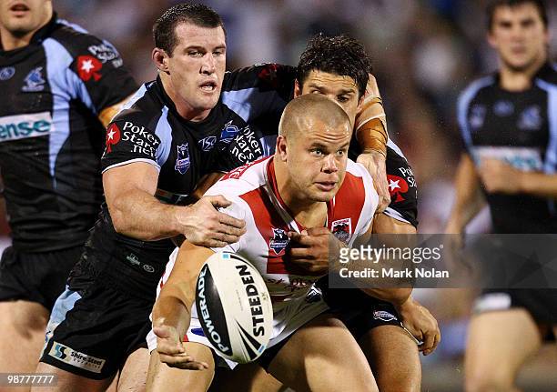 Dan Hunt of the Dragons offloads during the round eight NRL match between the St George Dragons and the Cronulla Sharks at WIN Stadium on May 1, 2010...
