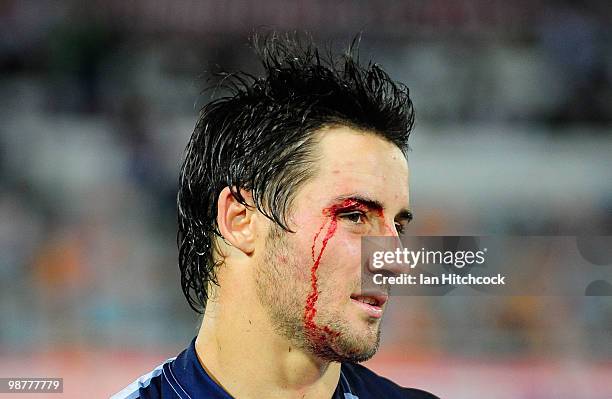 Cooper Cronk of the Storm bleeds from a head wound during the round eight NRL match between the North Queensland Cowboys and the Melbourne Storm at...