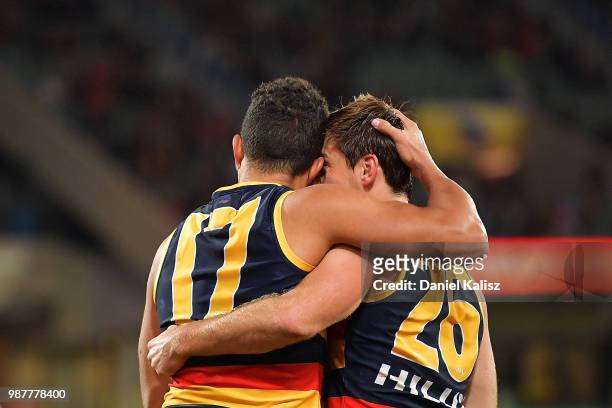 Curly Hampton of the Crows and Richard Douglas of the Crows celebrate during the round 15 AFL match between the Adelaide Crows and the West Coast...