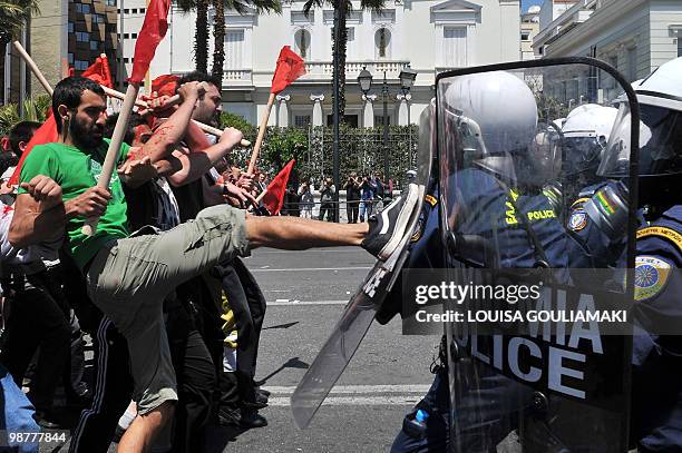 Demonstrators clash with policemen outside the greek Parliament during a Mayday demonstration on May 1 in Athens. Greek police fired tear gas on...