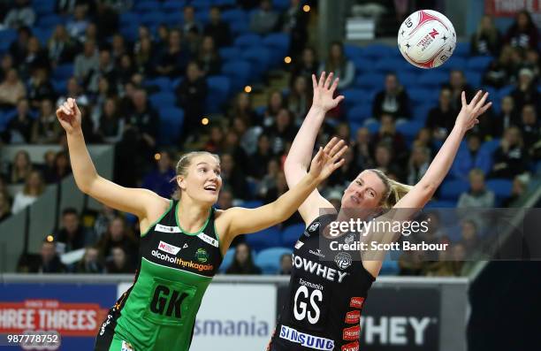 Caitlin Thwaites of the Magpies and Courtney Bruce of the Fever compete for the ball during the round nine Super Netball match between the Magpies...