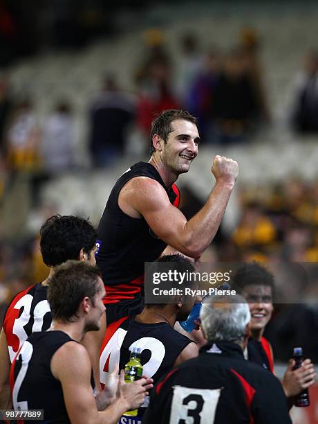 Jobe Watson of the Bombers celebrates while being chaired off after his 100th match after the round six AFL match between the Essendon Bombers and...