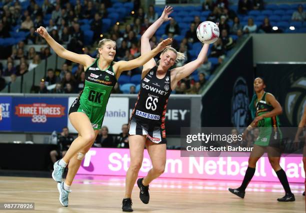 Caitlin Thwaites of the Magpies and Courtney Bruce of the Fever compete for the ball during the round nine Super Netball match between the Magpies...