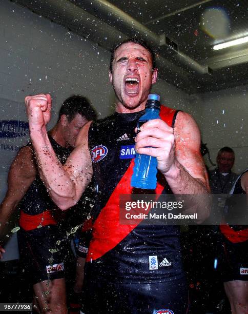 Jobe Watson Captain of the Bombers is sprayed with sportsdrink as they sing the team song after their win in the round 6 AFL match between the...