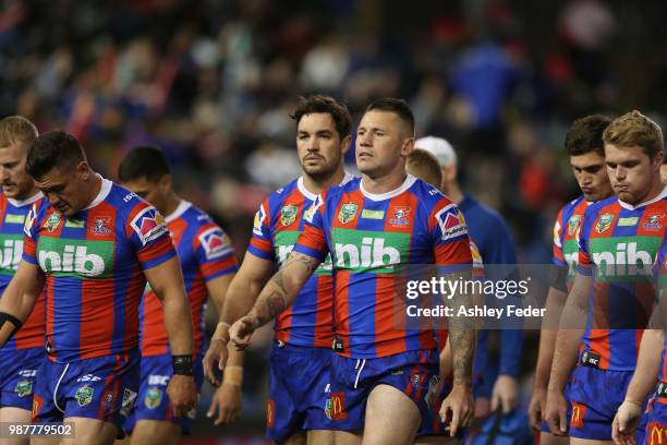 Shaun Kenny-Dowall of the Knights walks with his team during the round 16 NRL match between the Newcastle Knights and the Canterbury Bulldogs at...