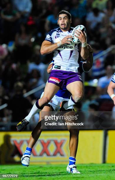 Greg Inglis of the Storm takes a high ball during the round eight NRL match between the North Queensland Cowboys and the Melbourne Storm at Dairy...