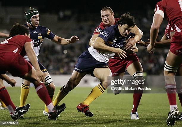 Adam Ashley-Cooper of the Brumbies is tackled during the round 12 Super 14 match between the Brumbies and the Reds at Canberra Stadium on May 1, 2010...