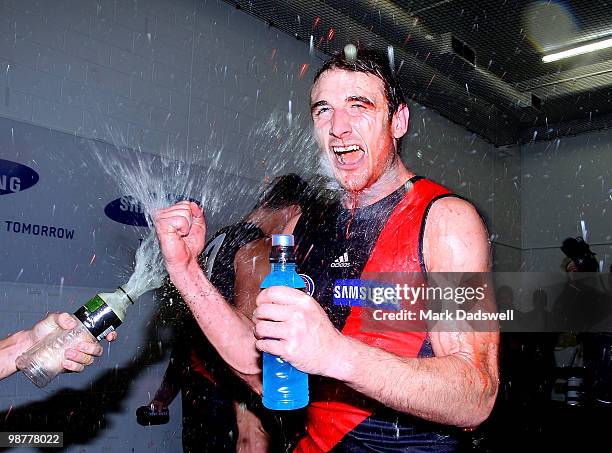 Jobe Watson Captain of the Bombers is sprayed with sportsdrink as they sing the team song after their win in the round 6 AFL match between the...