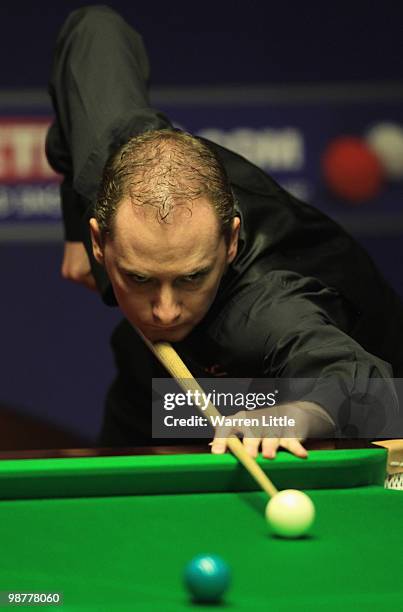 Graeme Dott of Scotland in action against Mark Selby of England during the semi final of the Betfred.com World Snooker Championships at The Crucible...