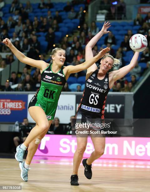 Caitlin Thwaites of the Magpies and Courtney Bruce of the Fever compete for the ball during the round nine Super Netball match between the Magpies...