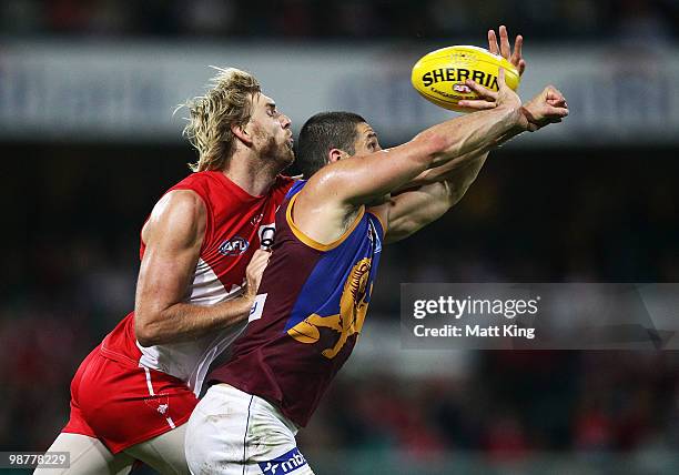 Lewis Roberts-Thomson of the Swans spoils Brendan Fevola of the Lions during the round six AFL match between the Sydney Swans and the Brisbane Lions...