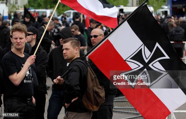 Neo-Nazi supporter arrives bearing colours of the pre-World War I German Empire at a rally and march on May 1, 2010 in Berlin, Germany. Several...