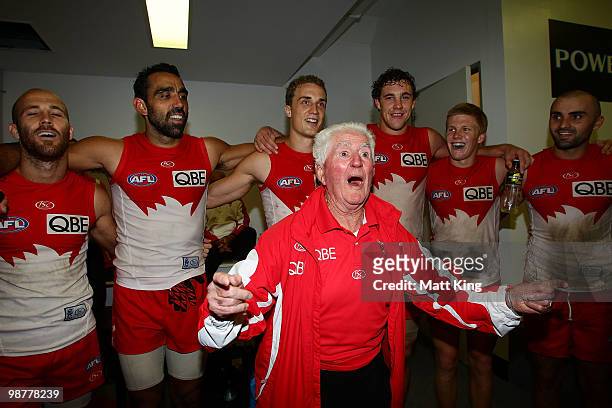 Kenny Williams leads Swans players in their club song after victory during the round six AFL match between the Sydney Swans and the Brisbane Lions at...