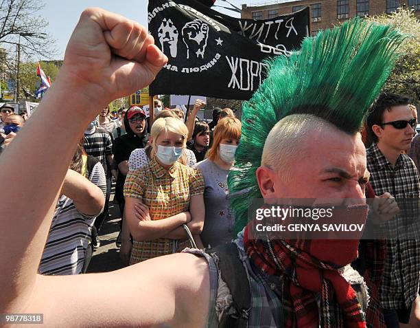 Far left Ukrainian activists wave their fist and shout slogans during a rally to mark May Day in Kiev�s downtown on May 1, 2010. AFP PHOTO/GENYA...