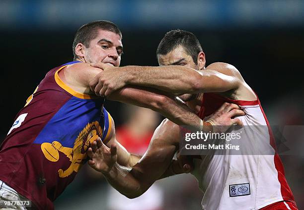 Jonathan Brown of the Lions wrestles with Heath Grundy of the Swans during the round six AFL match between the Sydney Swans and the Brisbane Lions at...