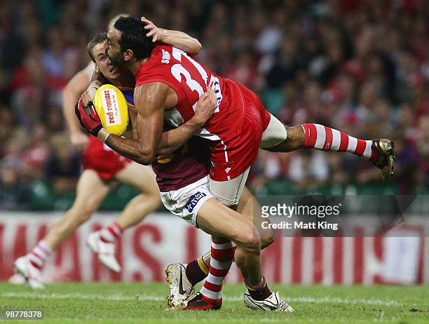 Adam Goodes of the Swans is tackled during the round six AFL match between the Sydney Swans and the Brisbane Lions at the Sydney Cricket Ground on...