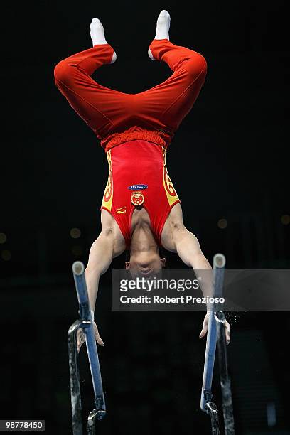 Shixiong Zhou of China competes in the Parallel Bars during day three of the 2010 Pacific Rim Championships at Hisense Arena on May 1, 2010 in...