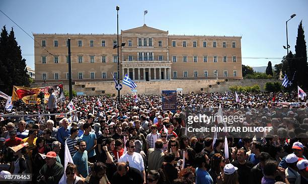Supporters of the Greek Communist party attend a May Day protest in front of Greek parliament building in Athens on May 1, 2010. Greek police fired...