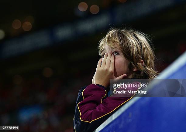Young Lions fan shows emotion during the round six AFL match between the Sydney Swans and the Brisbane Lions at the Sydney Cricket Ground on May 1,...