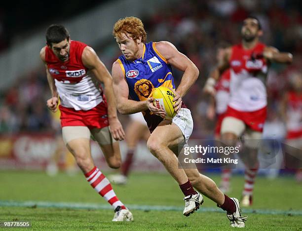 Todd Banfield of the Lions runs with the ball during the round six AFL match between the Sydney Swans and the Brisbane Lions at the Sydney Cricket...