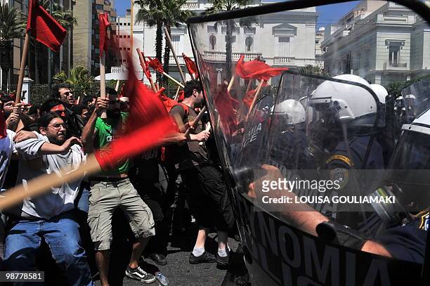 Protestors clash with police by the Greek parliament during a massive Mayday demonstration to protest against austerity measures in Athens on May 1,...