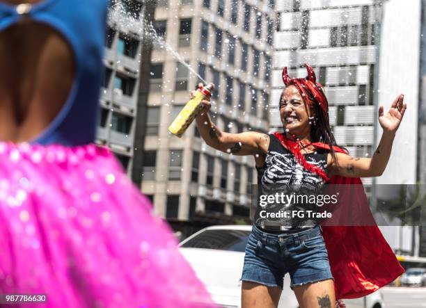 friends having fun on a carnaval celebration in brazil - halloween in sao paulo stock pictures, royalty-free photos & images