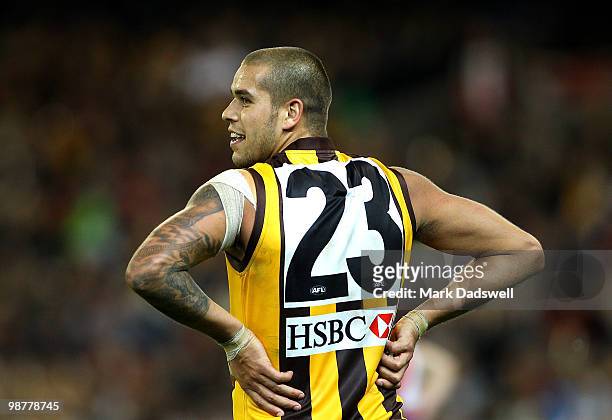 Lance Franklin of the Hawks remarks to his opponent during the round 6 AFL match between the Essendon Bombers and the Hawthorn Hawks at Melbourne...