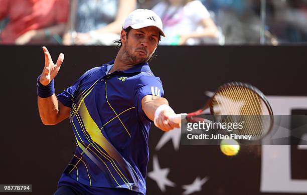 Fernando Verdasco of Spain plays a forehand in his match against David Ferrer of Spain plays a backhand in his match against during day seven of the...