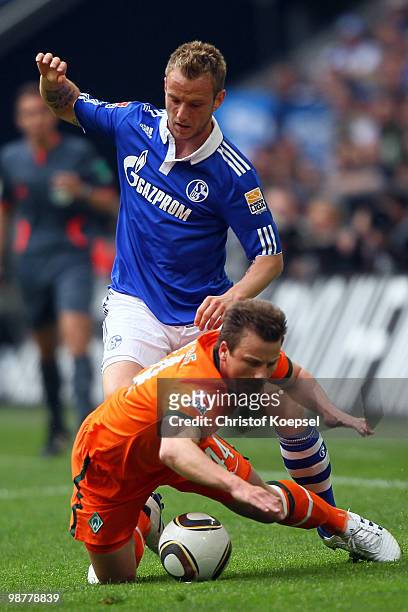 Ivan Rakitic of Schalke challenges Philipp Bargfrede of Bremen during the Bundesliga match between FC Schalke 04 and SV Werder Bremen at Veltins...