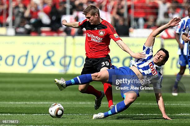 Toni Kroos of Leverkusen is challenged by Gojko Kacar of Berlin during the Bundesliga match between Bayer Leverkusen and Hertha BSC Berlin at the...